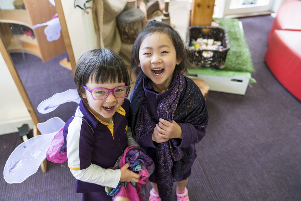 Two girls laughing